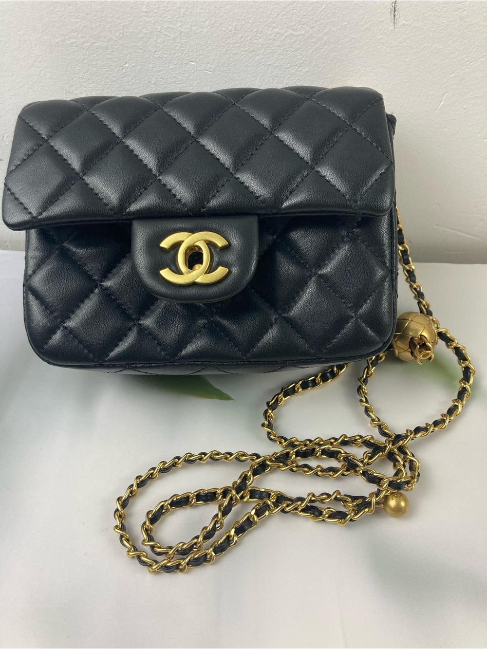 CHANEL Black Quilted Mini Crossbody with Gold Chain & CC Logo